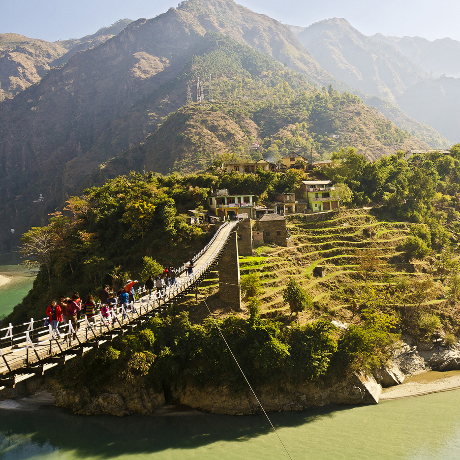 Suspension bridge in hills – bold adventure travel