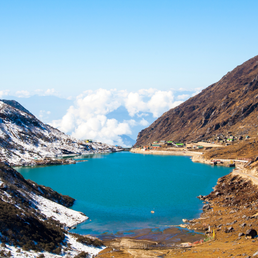 Snow lake with village – scenic traveler spot