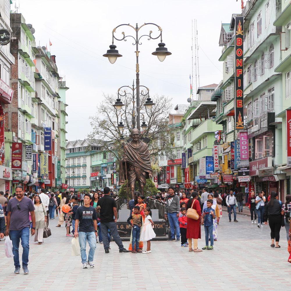 Tourists on MG Marg – vibrant cultural tour